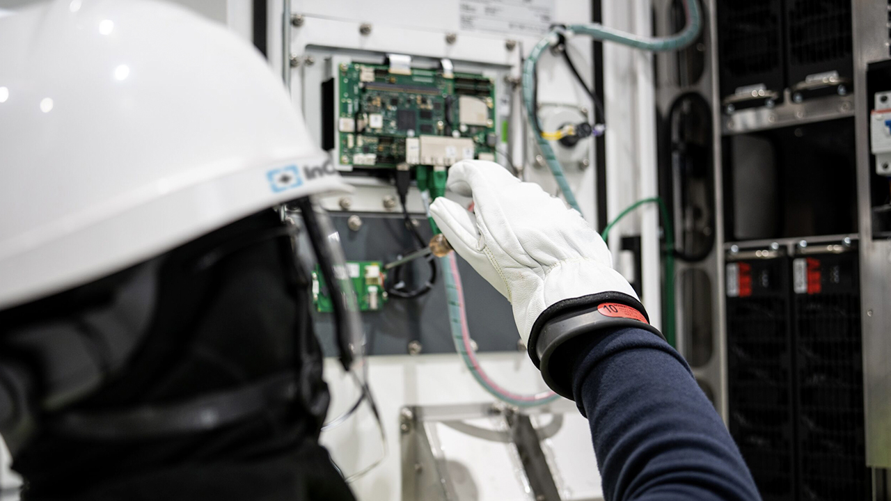 Closeup of technician fixing charger